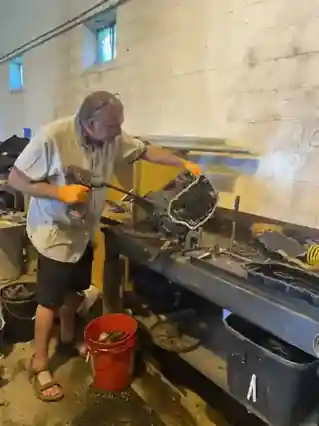 Benjamin Hornung working hands-on with mechanical equipment in 2024